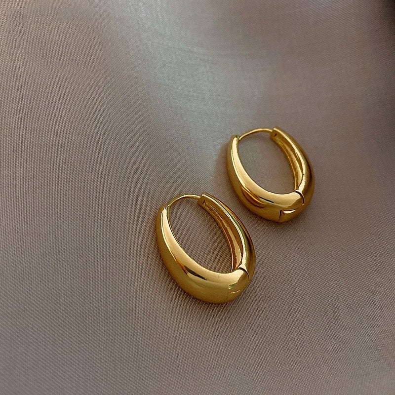 Gold Oval Huggie Earrings